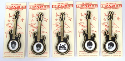 Lot 1336 - The Beatles Guitar Brooches featuring black...