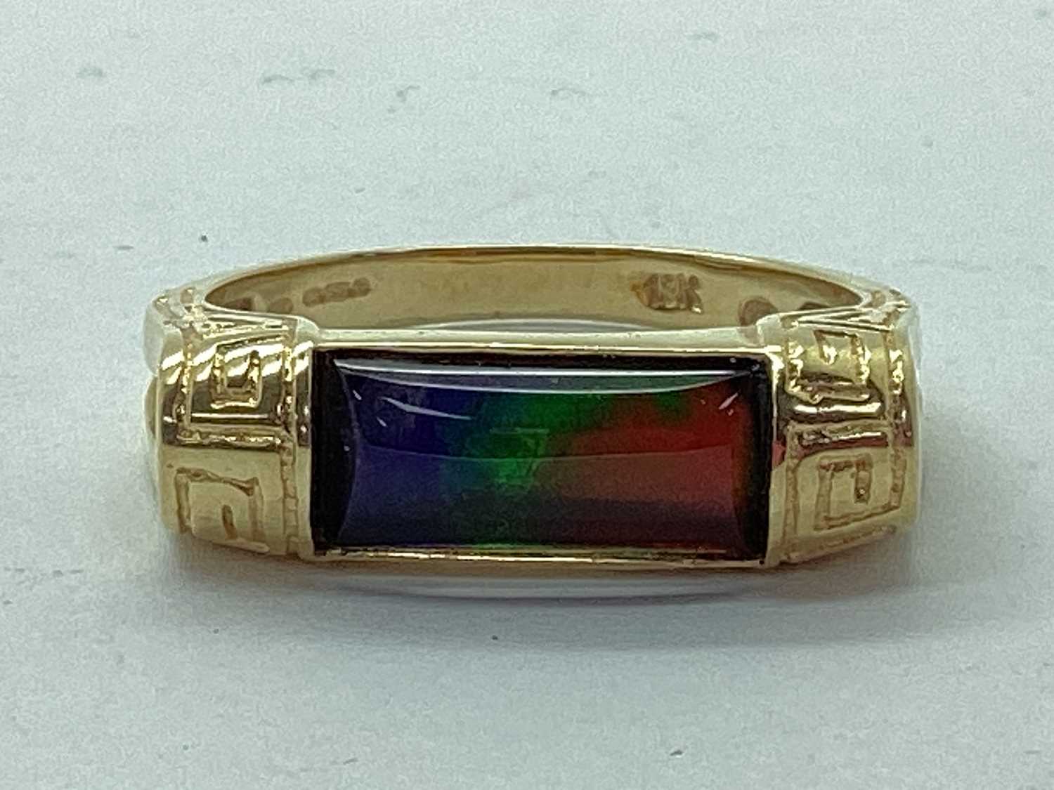 Lot 54 - Korite; An Ornate Ammolite Set Ring, the...