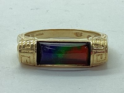 Lot 54 - Korite; An Ornate Ammolite Set Ring, the...
