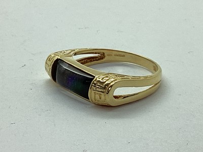 Lot 54 - Korite; An Ornate Ammolite Set Ring, the...