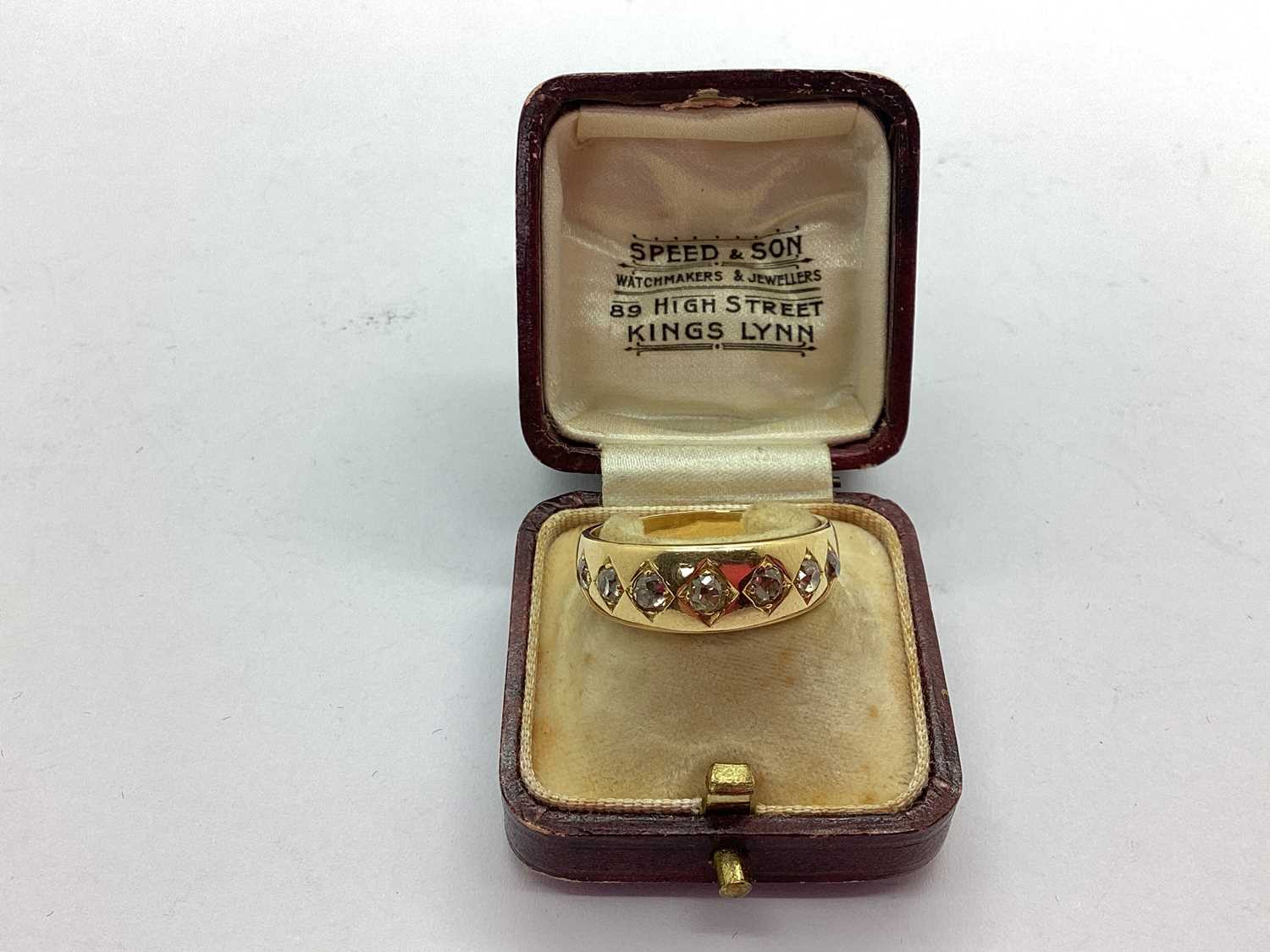 Lot 60 - An 18ct Gold Seven Stone Diamond Band, the old...