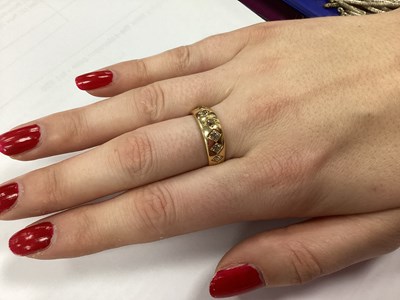 Lot 60 - An 18ct Gold Seven Stone Diamond Band, the old...