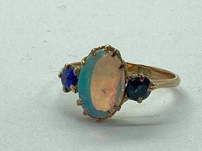 Lot 75 - An Antique Opal Set Ring, oval shallow claw...