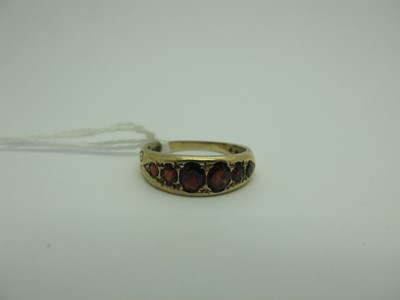 Lot 301 - A 9ct Gold Six Stone Garnet Ring, of antique...