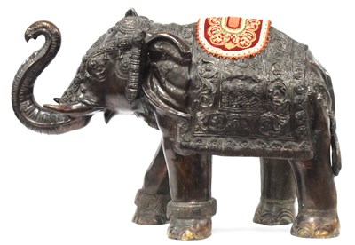 Lot 1134 - A Large Bronzed Model of an Elephant, in a...