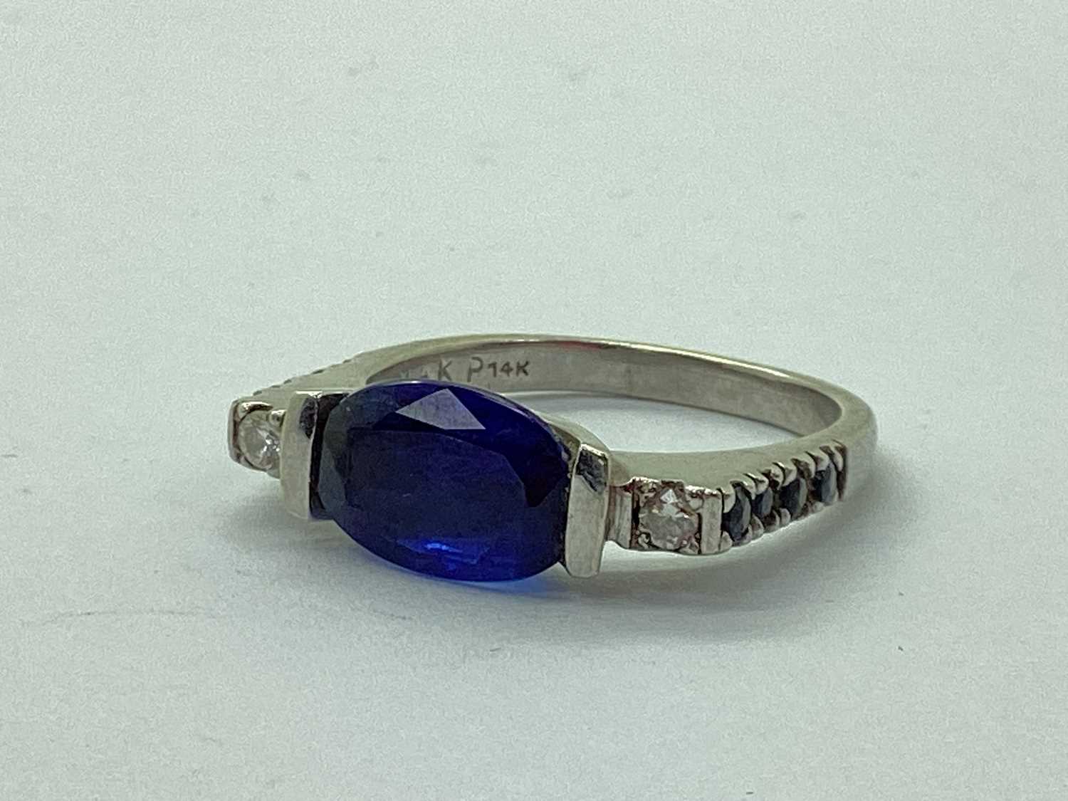 Lot 70 - A Modern Sapphire and Diamond Three Stone Ring,...