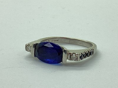 Lot 70 - A Modern Sapphire and Diamond Three Stone Ring,...