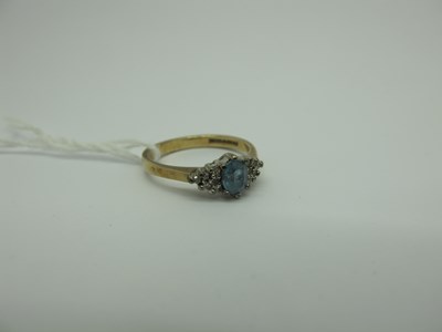 Lot 300 - A Modern 9ct Gold Blue Topaz and Diamond Dress...