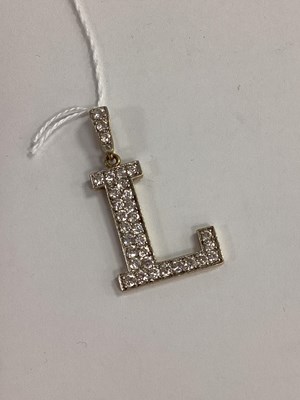 Lot 311 - A Large Modern Initial 'L' Pendant, claw set...
