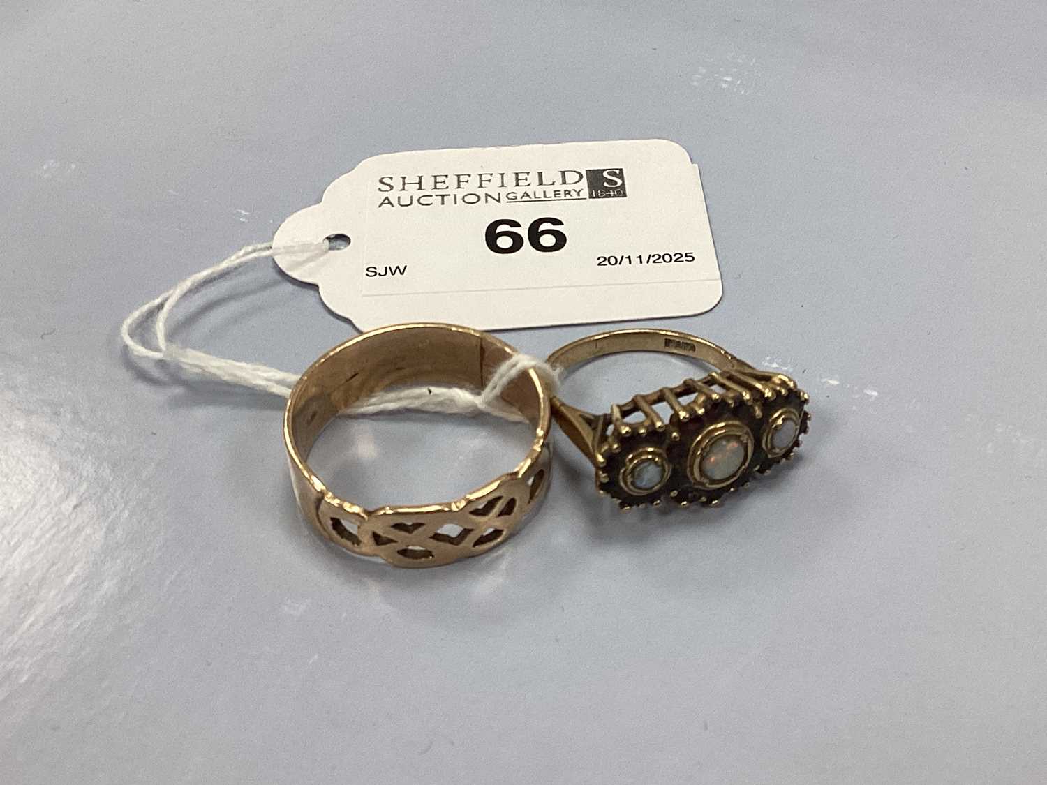 Lot 66 - A 9ct Gold Opal Inset Triple Cluster Ring,...