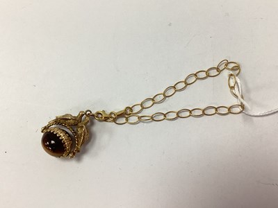 Lot 90 - A 9ct Gold Cabochon Tiger's Eye Inset Swivel...