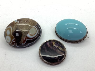 Lot 228 - A Circular Polished Blue John Brooch, within a...