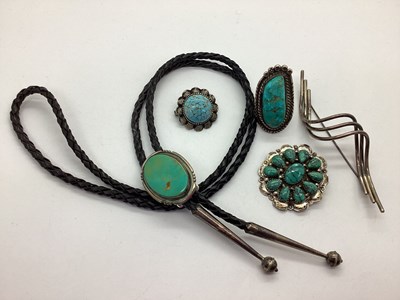 Lot 230 - An Oval Collet Set Bolo Tie, the polished...