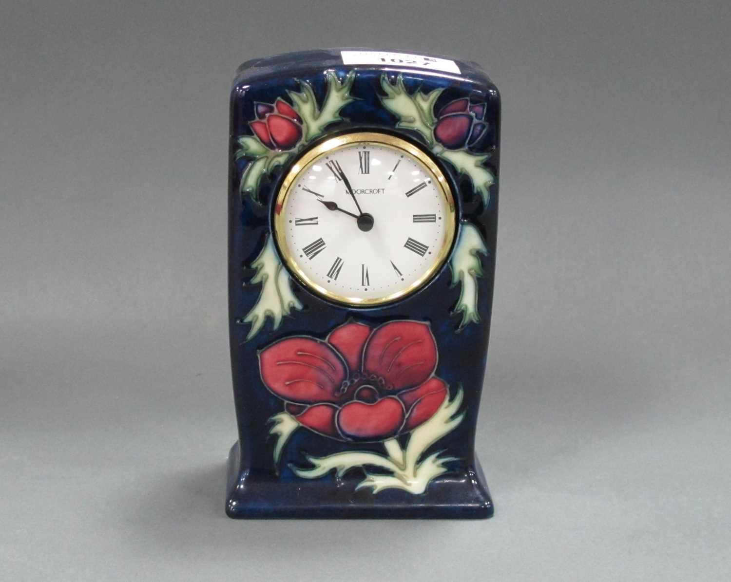 Lot 1027 - A Moorcroft Pottery Mantle Clock, painted in...