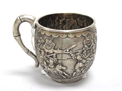 Lot 15 - A Chinese Cup, allover detailed in relief with...