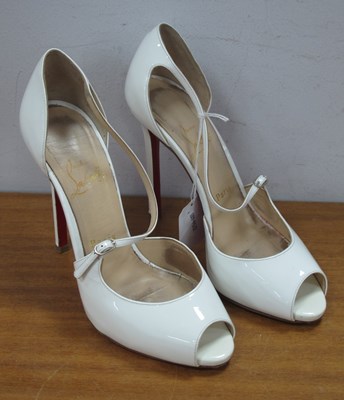 Lot 1399 - Christian Louboutin Paris: A pair of white...