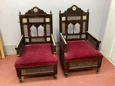 Lot 1546 - A pair of Islamic inlaid armchairs with...