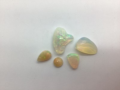 Lot 215 - Five Unmounted Polished Opals, irregular, pear,...