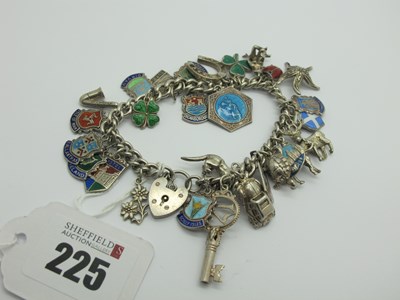 Lot 225 - A Curb Link Charm Bracelet, to heart shape...