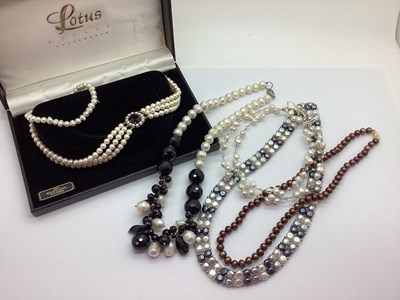 Lot 12 - A Knotted Chocolate Coloured Pearl Necklace...