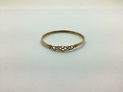 Lot 250 - A Modern 9ct Gold Bangle, of openwork woven...