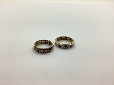 Lot 266 - An Eternity Band, alternately set stamped "9ct"...