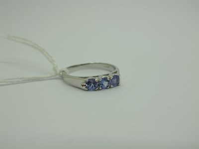 Lot 279 - A Modern 9ct White Gold Tanzanite Three Stone...