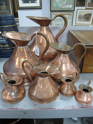 Lot 1454 - Seven Graduated Copper Jugs, the largest 1...