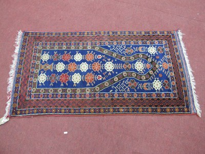 Lot 1582 - Middle Eastern Wool Tassled Rug, with vase and...