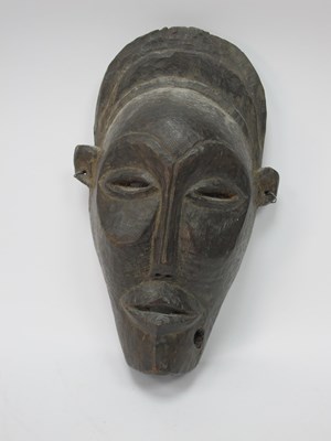 Lot 1165 - Tribal Art: An African Carved Wood Face Mask,...