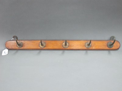 Lot 1207 - An Early XX Century Wall Coat Rack, with brass...