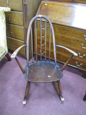 Lot 1679 - Ercol Rocking chair, with spindle back.