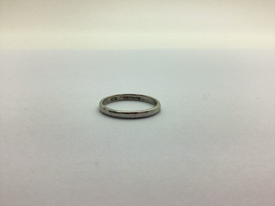 Lot 224 - A Narrow Wedding Band, stamped "Platinum"...