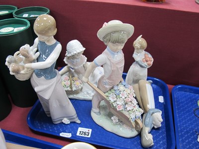 Lot 1263 - Lladro Figures, to include girl with puppies...