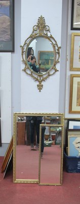 Lot 1511 - Gilded cast metal wall mirror with scroll...