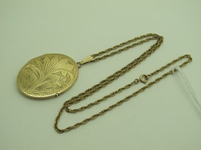 Lot 229 - A Large 9ct Gold Oval Locket, foliate engraved...