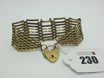 Lot 230 - A Wide Gate Style Bracelet, (damages) stamped "...