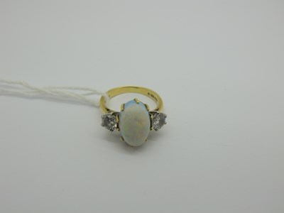 Lot 347 - An 18ct Gold Opal and Diamond Dress Ring,...