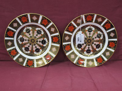 Lot 1205 - Two Royal Crown Derby plates decorated in...